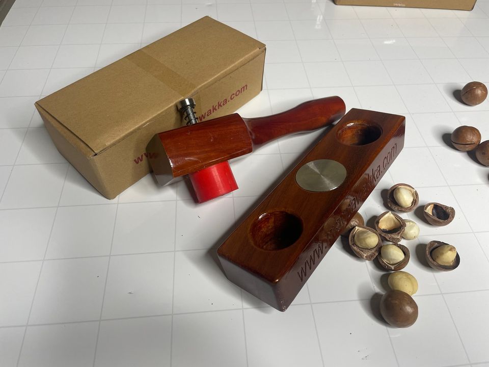 The MaccaWakka with its cardboard shipping box and whole macadamias in shell